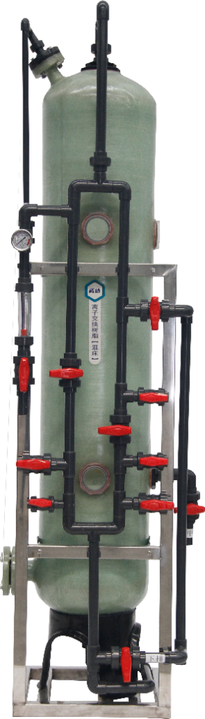 This picture shows a mixed-bed ion exchange column device used for industrial water treatment. The main body is a large, light green cylindrical container, usually made of corrosion-resistant fiberglass reinforced plastic (FRP) and supported by metal brackets. The core feature of the equipment lies in its complex and orderly piping system. Multiple black PVC pipes are connected to the top, bottom and sides of the column through several prominent red manual valves, precisely controlling the water flow, resin regeneration and chemical agent addition processes. Pressure gauges are also installed on the side of the column for real-time monitoring. Against a pure white background, the equipment structure is clear and prominent. The light green container, black pipes and red valves form a striking visual contrast. The overall design presents a modular and standardized industrial style, specifically providing deep deionization purification for industries such as electroplating, pharmaceuticals, and microelectronics that require ultra-pure water.